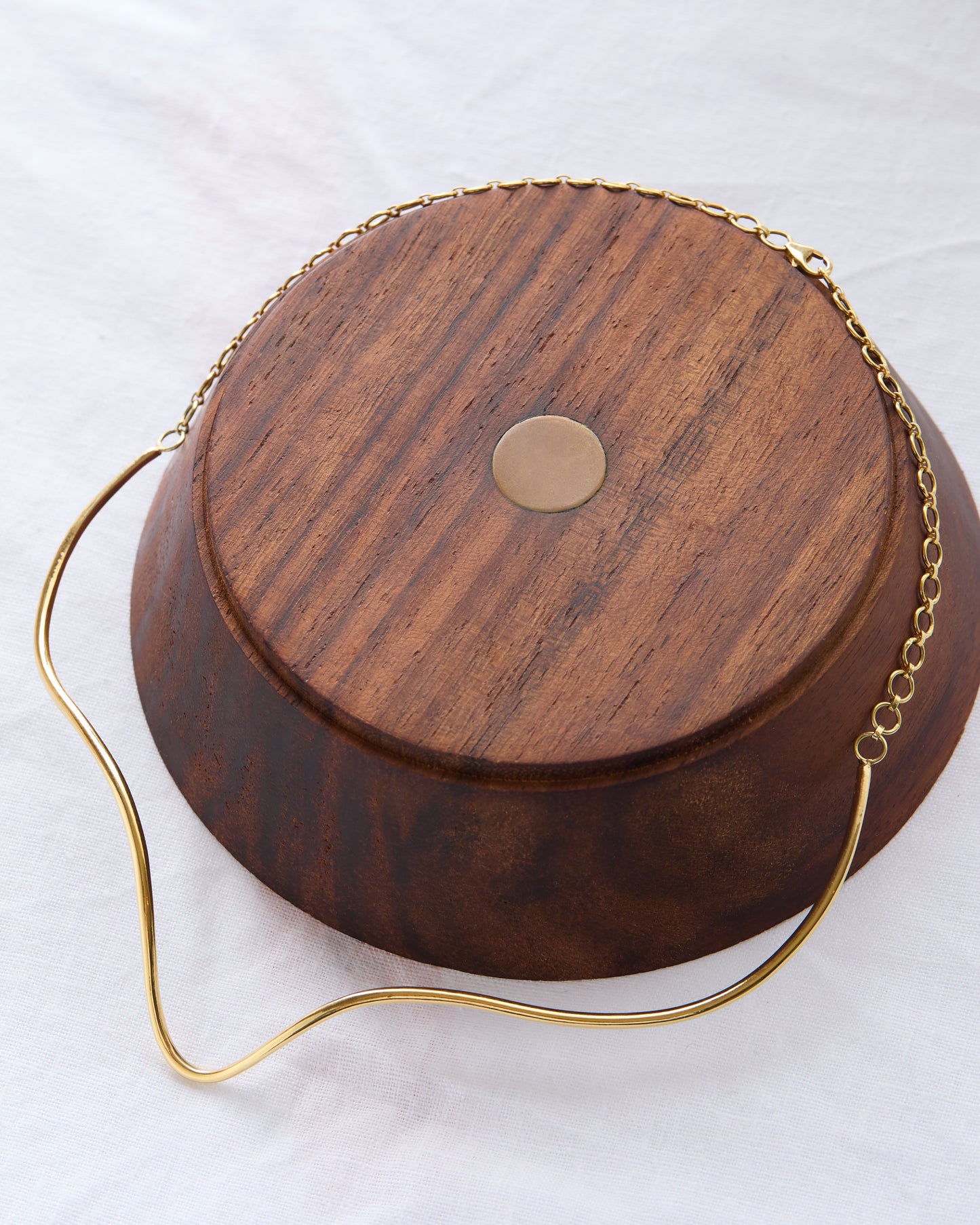 High-end sculptural torque necklace styled for formal and everyday wear