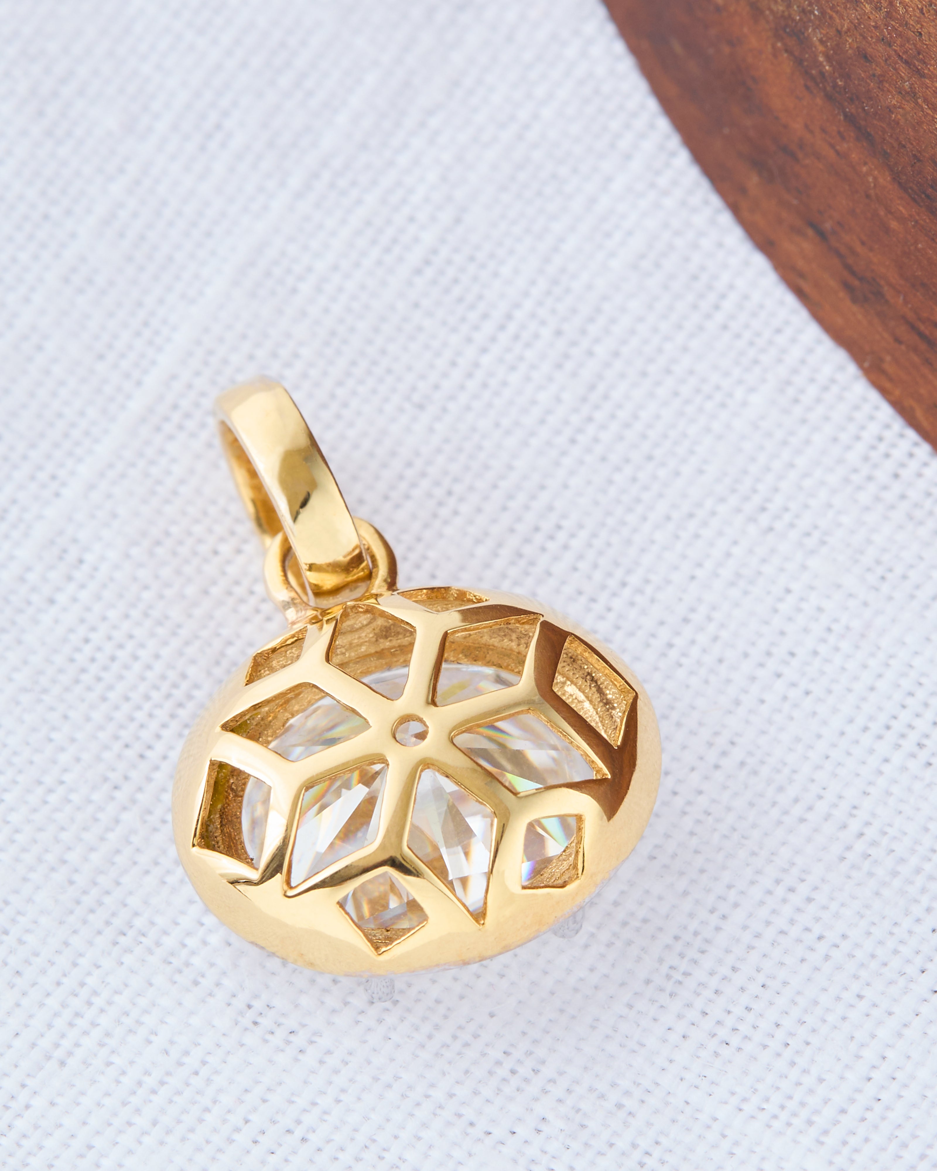 Close-up of the moissanite sunray pendant, emphasizing its intricate detailing.