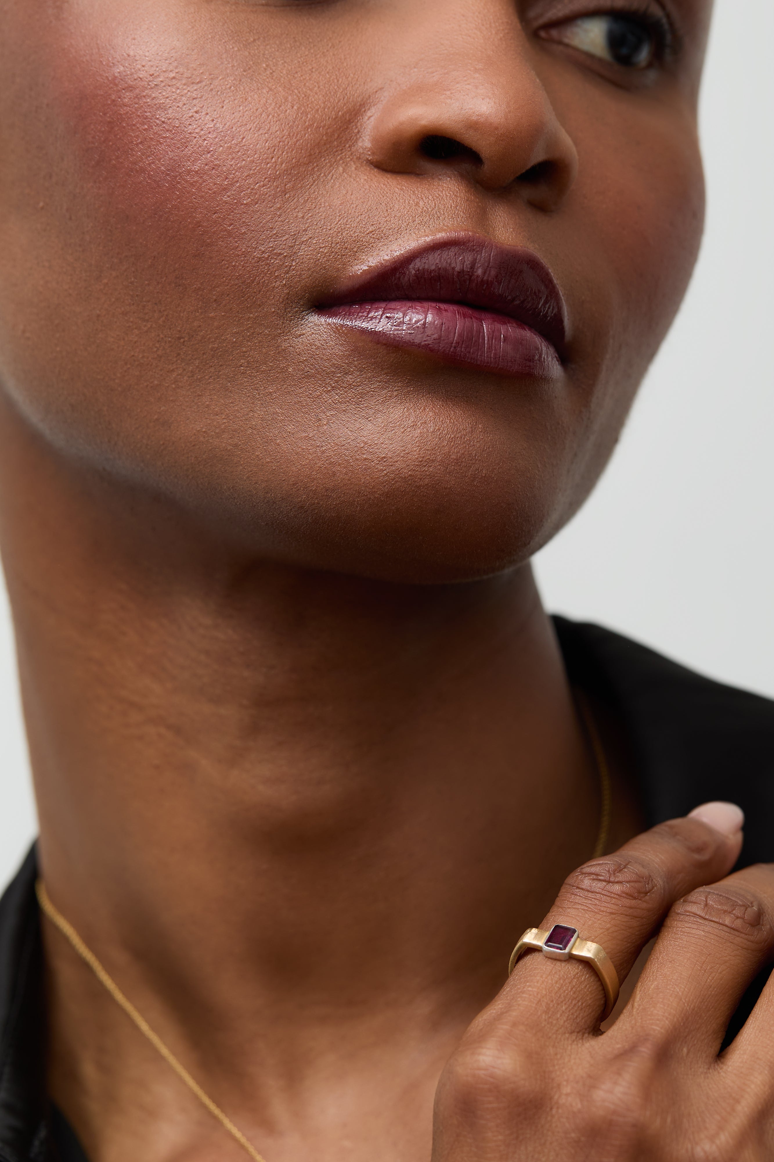 Model's hand adorned with the rhodolite cuff ring, showcasing its bold design.
