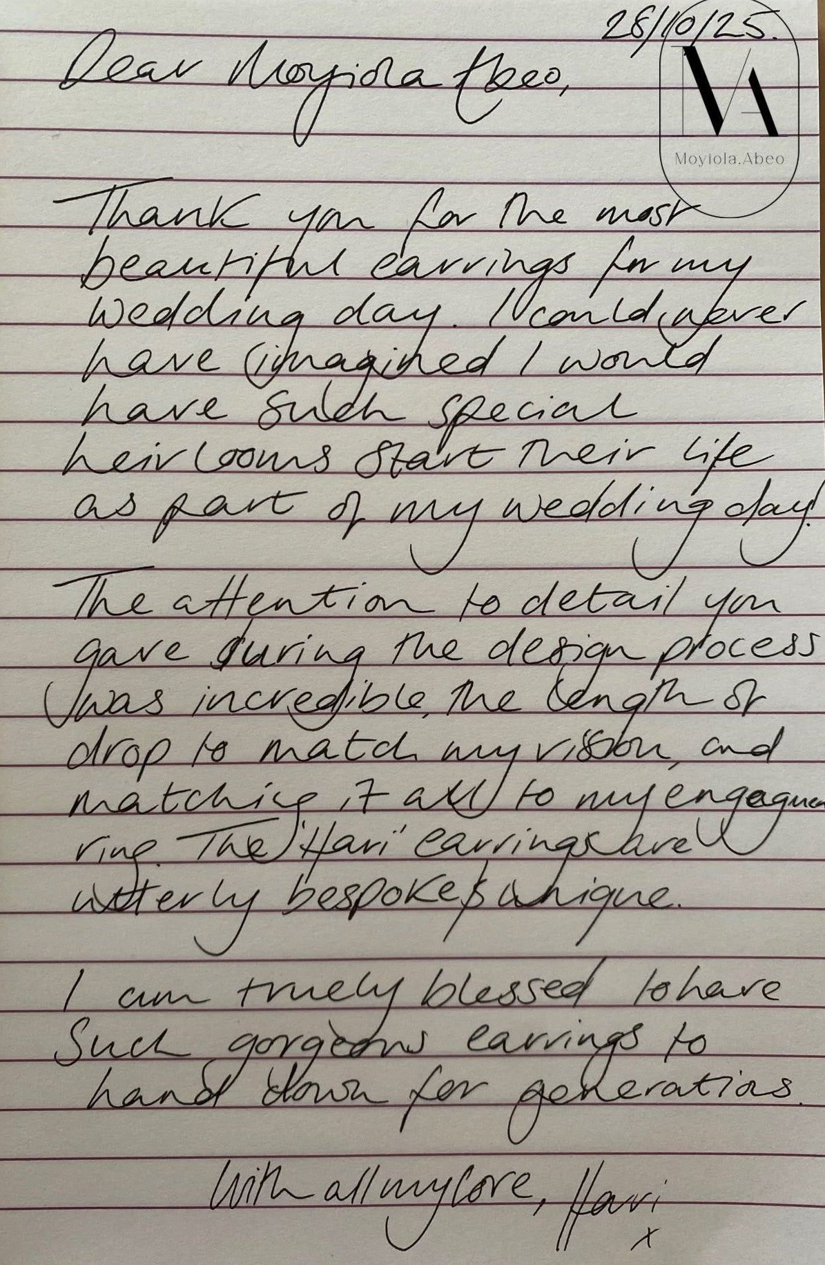 A handwritten letter on lined paper addressed to 'Moyiola.Abeo' thanking her for beautiful earrings on her wedding day. 
Dated 28/10/2025
She says that she loved the attention to detail during the design process and the drop that she found astounding in the earrings. It was her statement for the engagement and she is truly blessed to have such gorgeous earrings handed down for generations. 
It's from Hari.