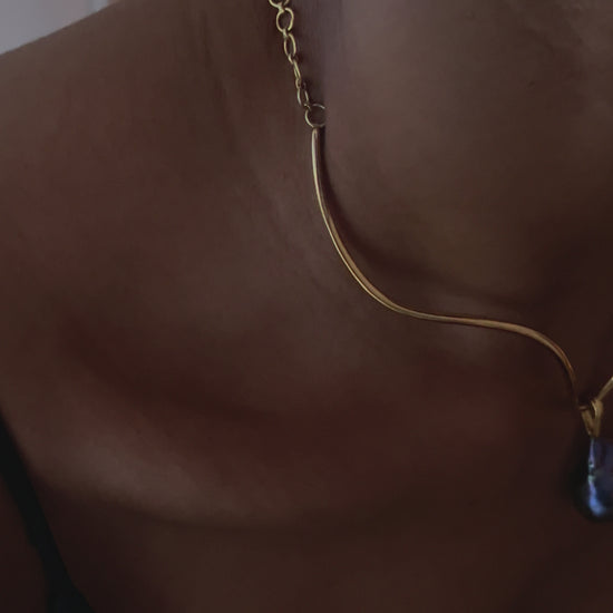 Video of model wearng the pear pendant on structured necklace