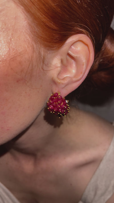 video of model wearing the ruby & pearl drop earrings, capturing their elegant movement.